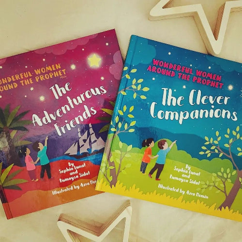 Two children's books titled 'The Adventurous Friends' and 'The Clever Companions' on a light wooden surface.