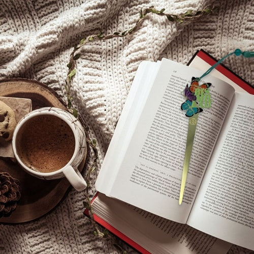 Bismillah enamel bookmark by Dua Gifts displayed on an open book