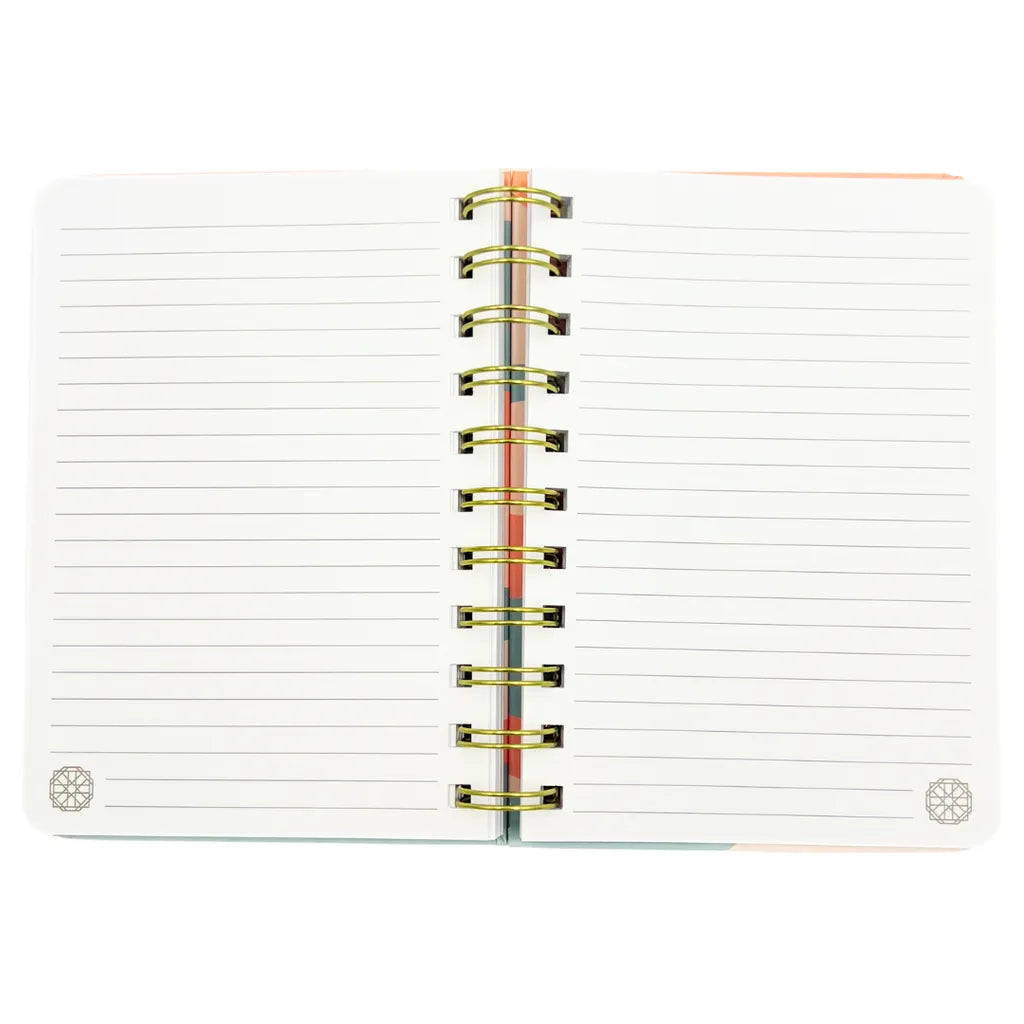 Open lined pages and gold spiral binding of the Dua Gifts A6 notebook