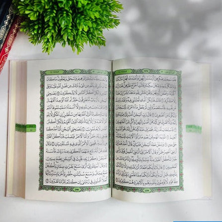 Dakwah Mushaf Madinah inside pages showing Surah Yusuf, green borders and juz markers — photo by DeenSquare