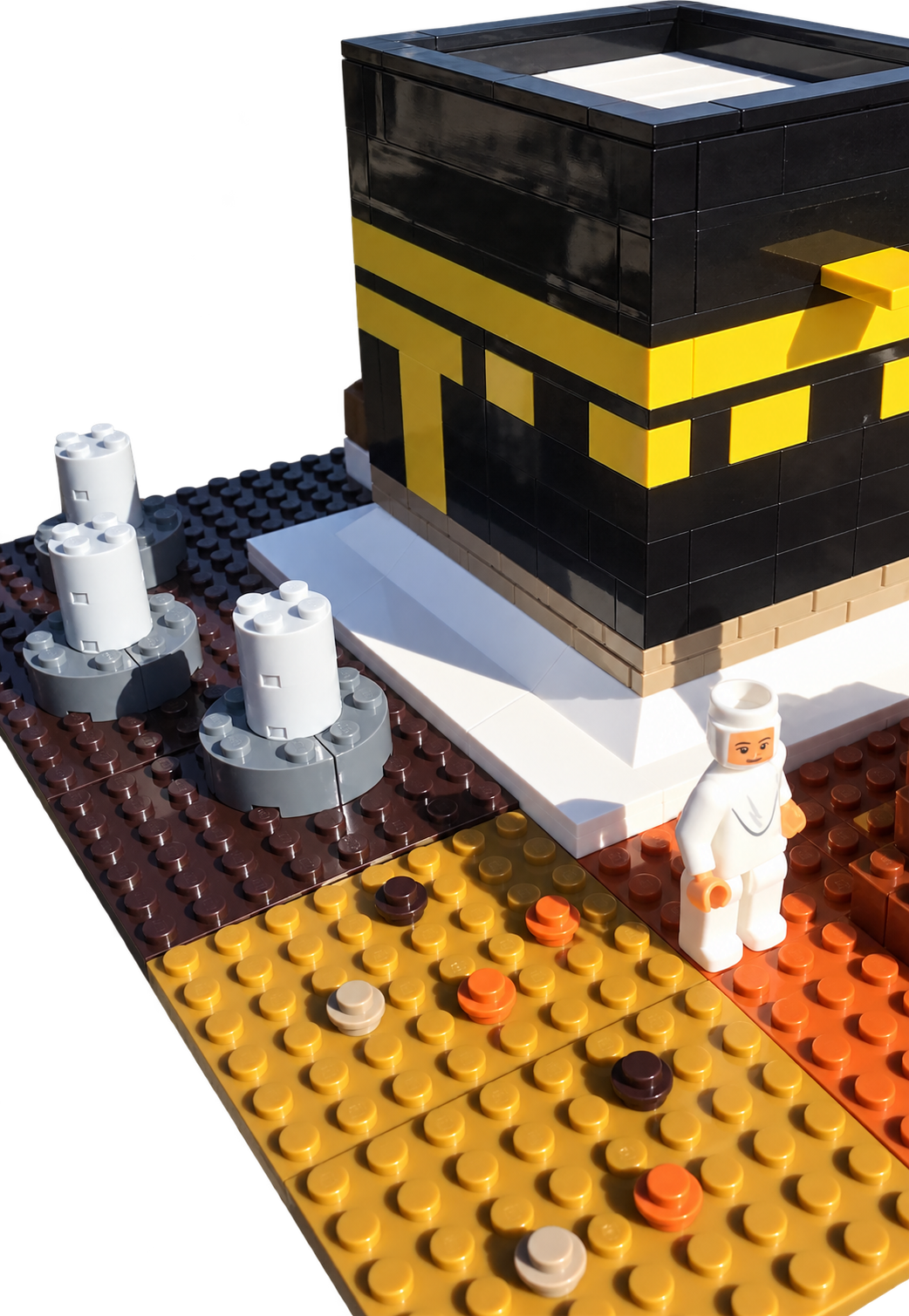 Hajj building blocks close-up with Kaabah and pilgrim figure, background removed